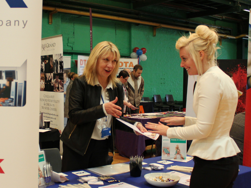 Staff talking to customers at York Jobs Fair