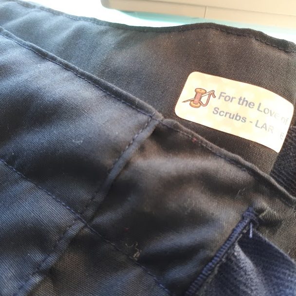 Finished trousers showing the 'For the Love of Scrubs' label