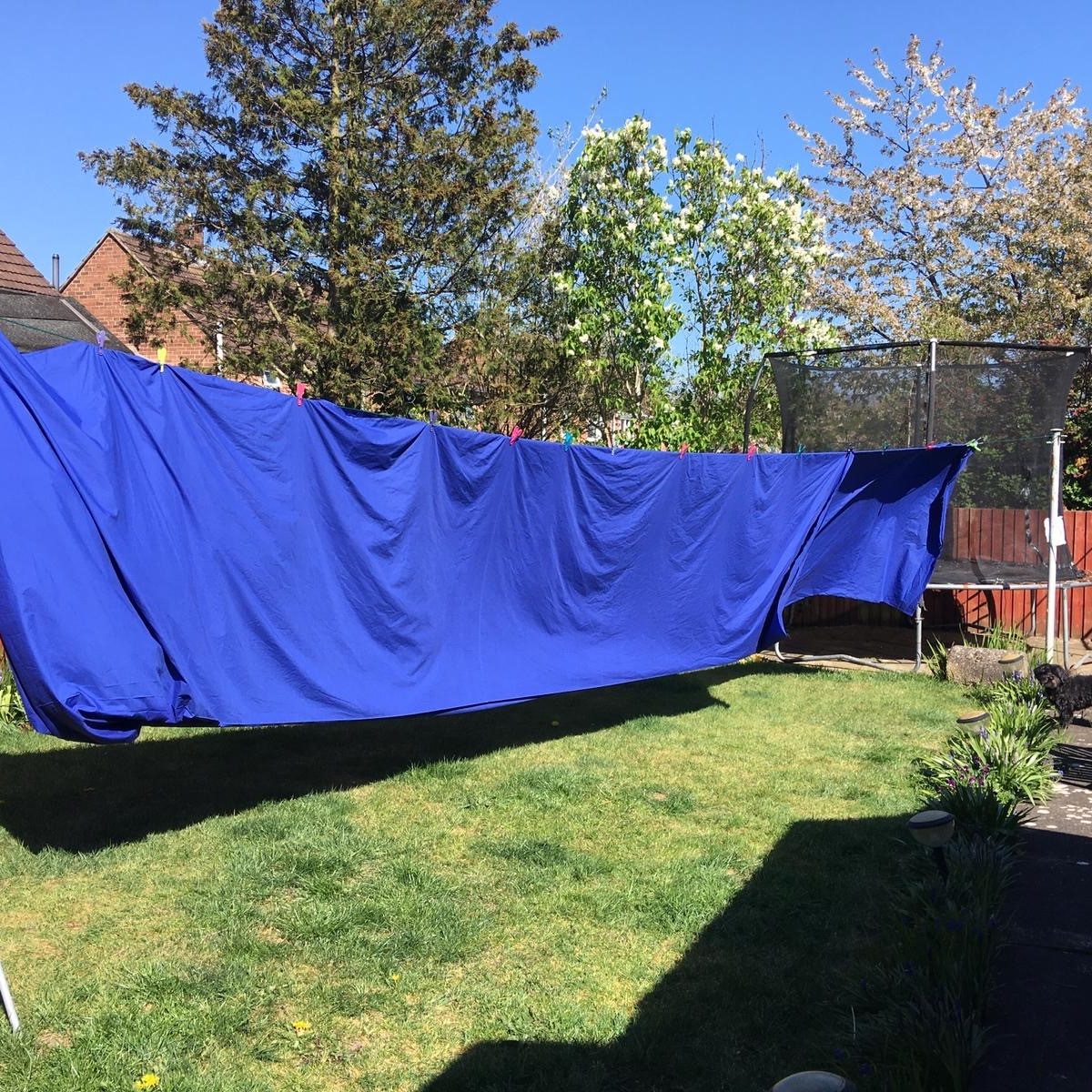 Yards of fabric handing on a washing line