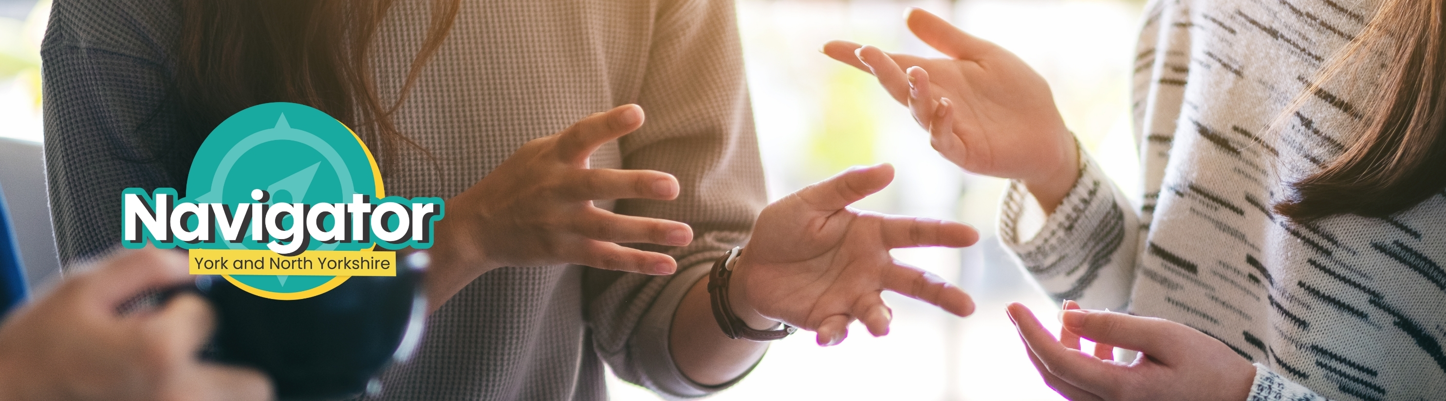 Navigator York and Selby banner, showing people gesturing with their hands during a conversation.