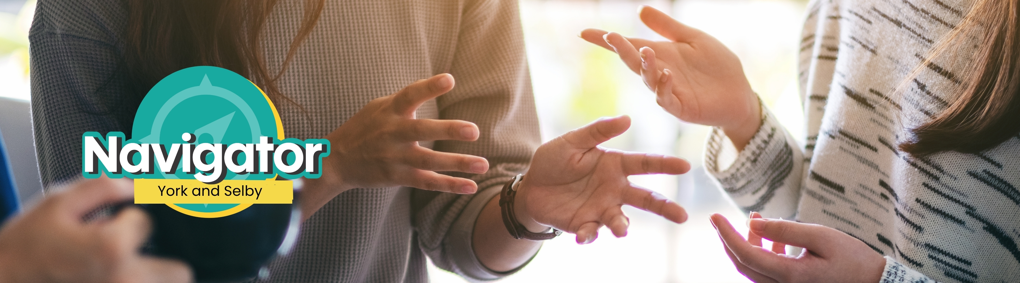 Navigator York and Selby banner, showing people gesturing with their hands during a conversation.